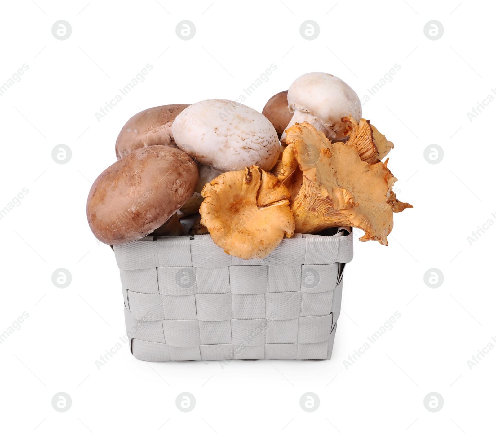 Photo of Basket with different mushrooms isolated on white