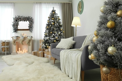 Decorated Christmas tree in modern living room interior