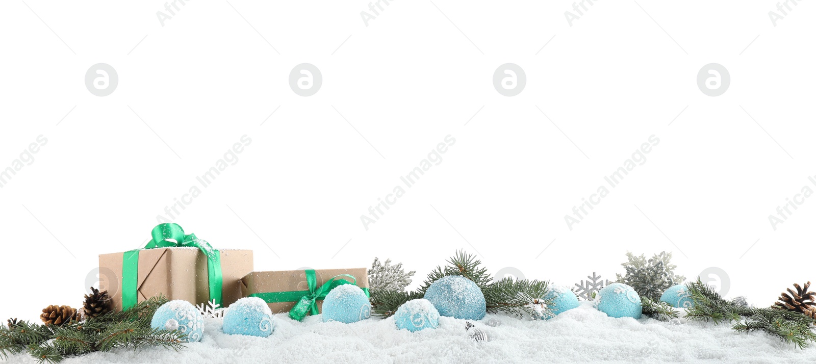 Photo of Fir branches, Christmas decoration and snow against white background