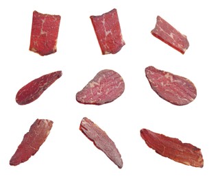 Image of Set with delicious beef jerky on white background