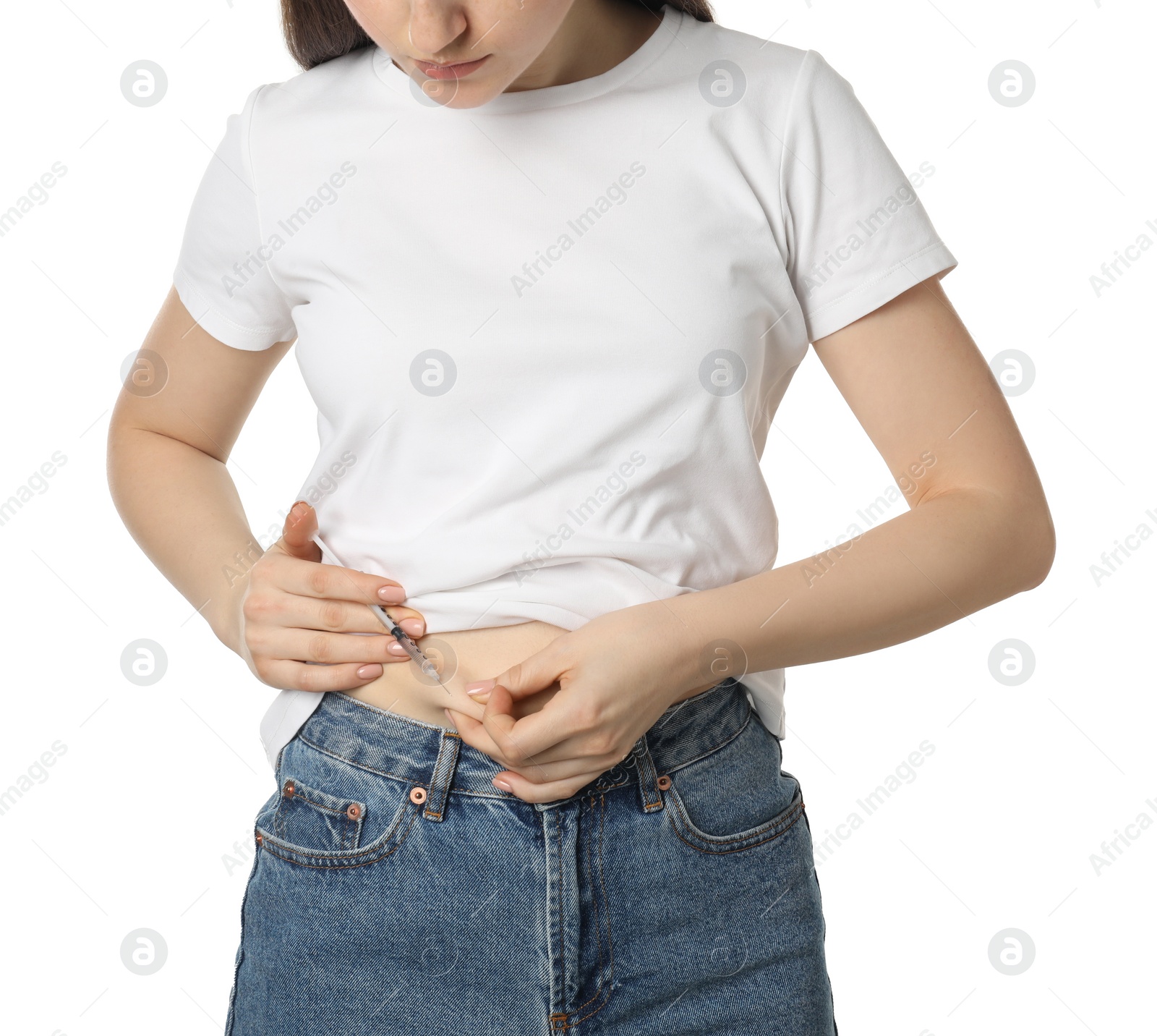 Photo of Diabetes. Woman making insulin injection into her belly on white background, closeup