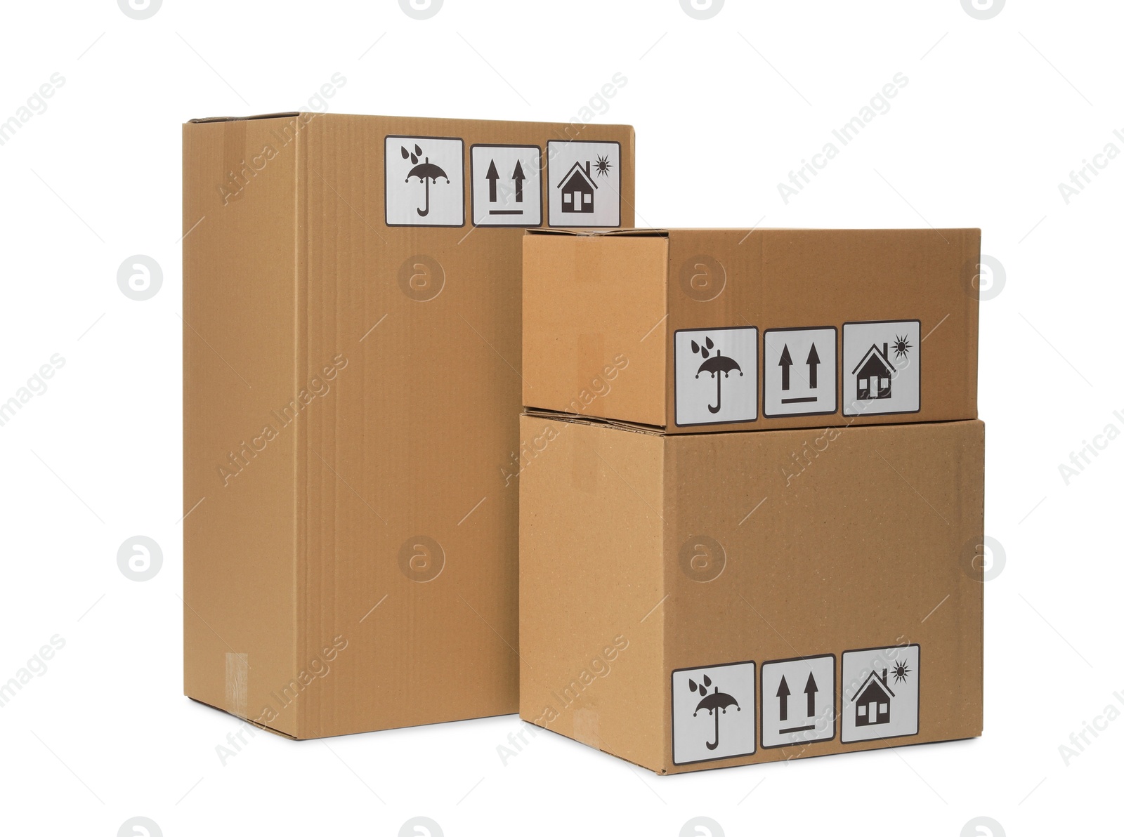 Photo of Many closed cardboard boxes with packaging symbols on white background. Delivery service