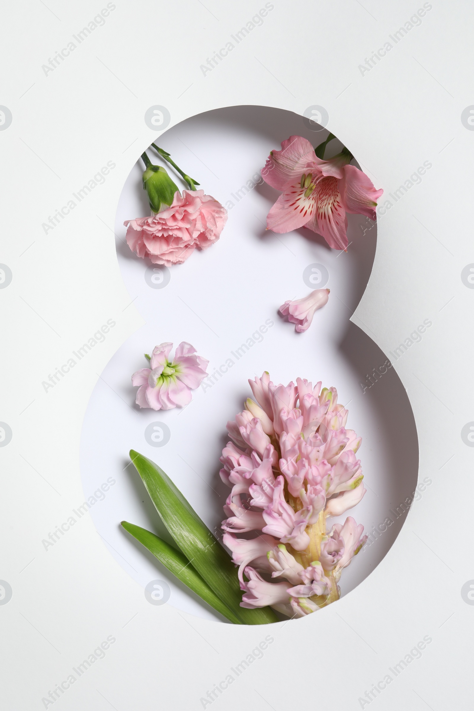 Photo of 8 March greeting card design with flowers, top view. Happy International Women's Day