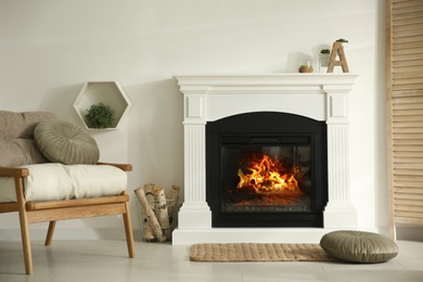 Photo of Bright living room interior with fireplace and basket of firewood