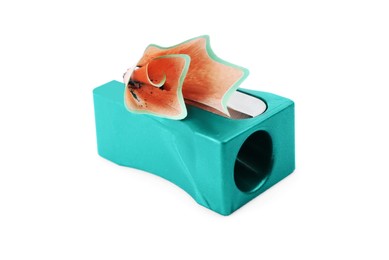 Photo of Turquoise sharpener with pencil shavings on white background