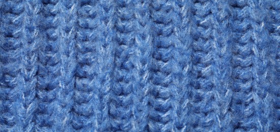 Texture of soft blue fabric as background, top view