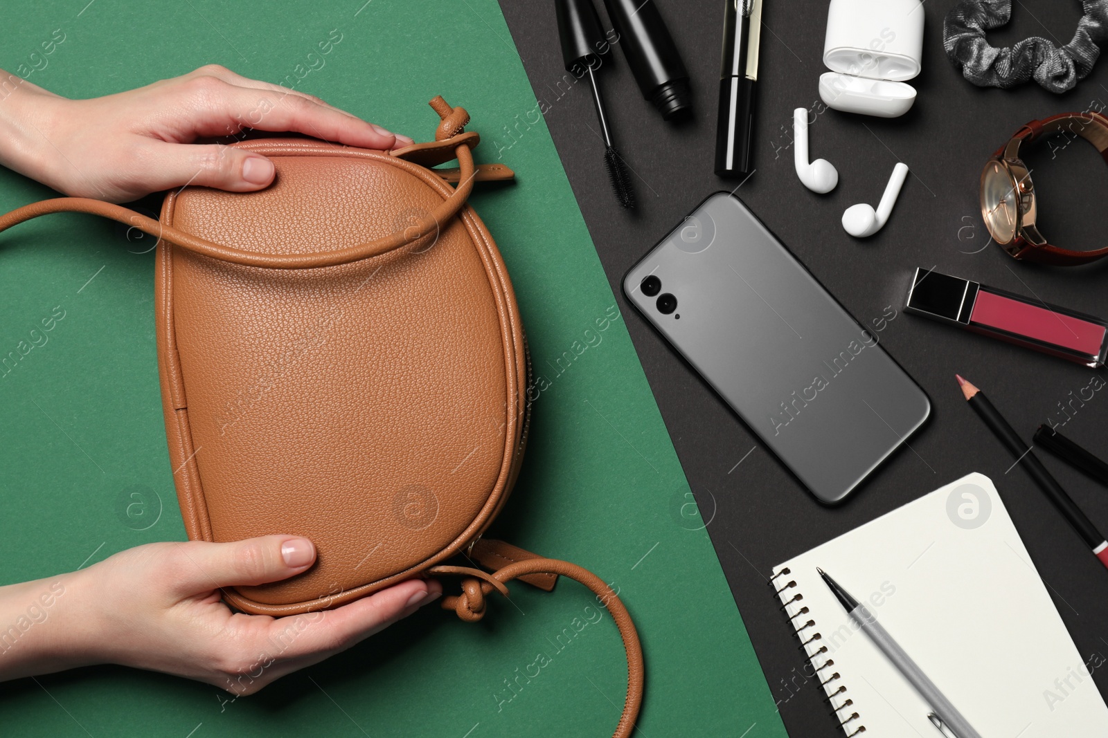 Photo of Woman with stylish bag, smartphone and different accessories on color background, top view