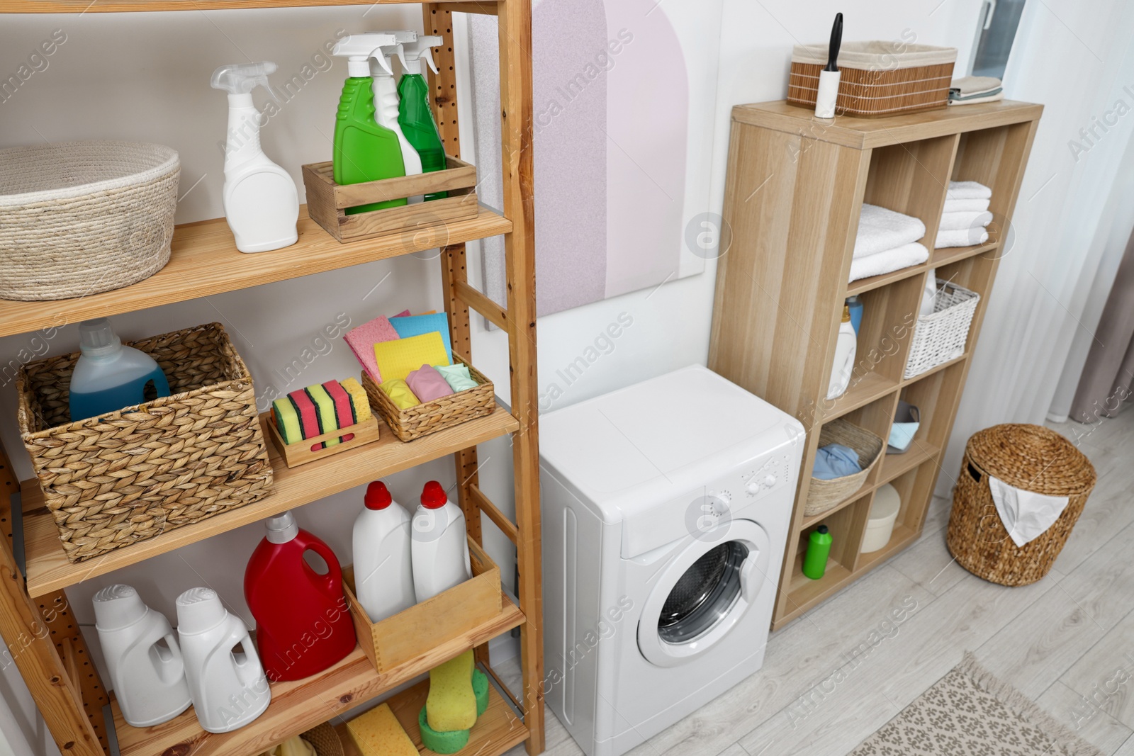 Photo of Laundry room interior with washing machine and furniture, above view