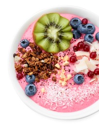 Photo of Tasty smoothie bowl with fresh kiwi fruit, berries and granola isolated on white, top view