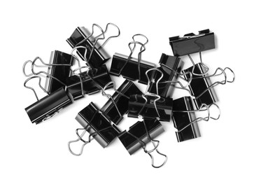 Photo of Black binder clips on white background, top view