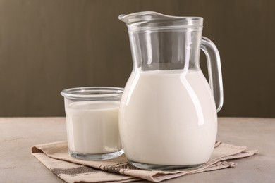 Photo of Glassware with tasty milk on light table