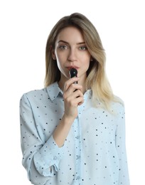 Photo of Young woman blowing into breathalyzer on white background
