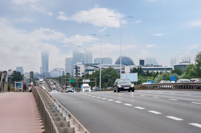 Photo of City road with cars on foggy day