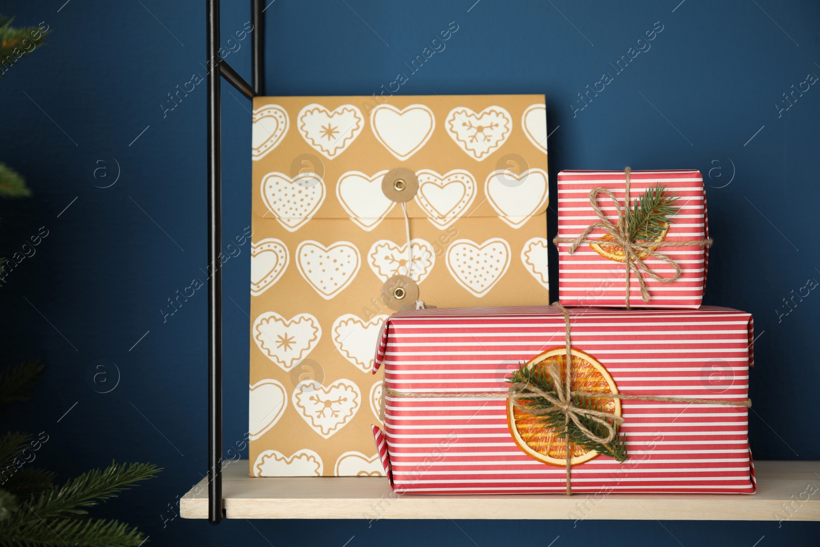 Photo of Beautifully decorated Christmas presents on rack indoors