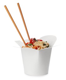 Photo of Box of vegetarian wok noodles with chopsticks isolated on white