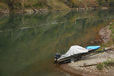 Photo of Beautiful view of river and trailer with boat