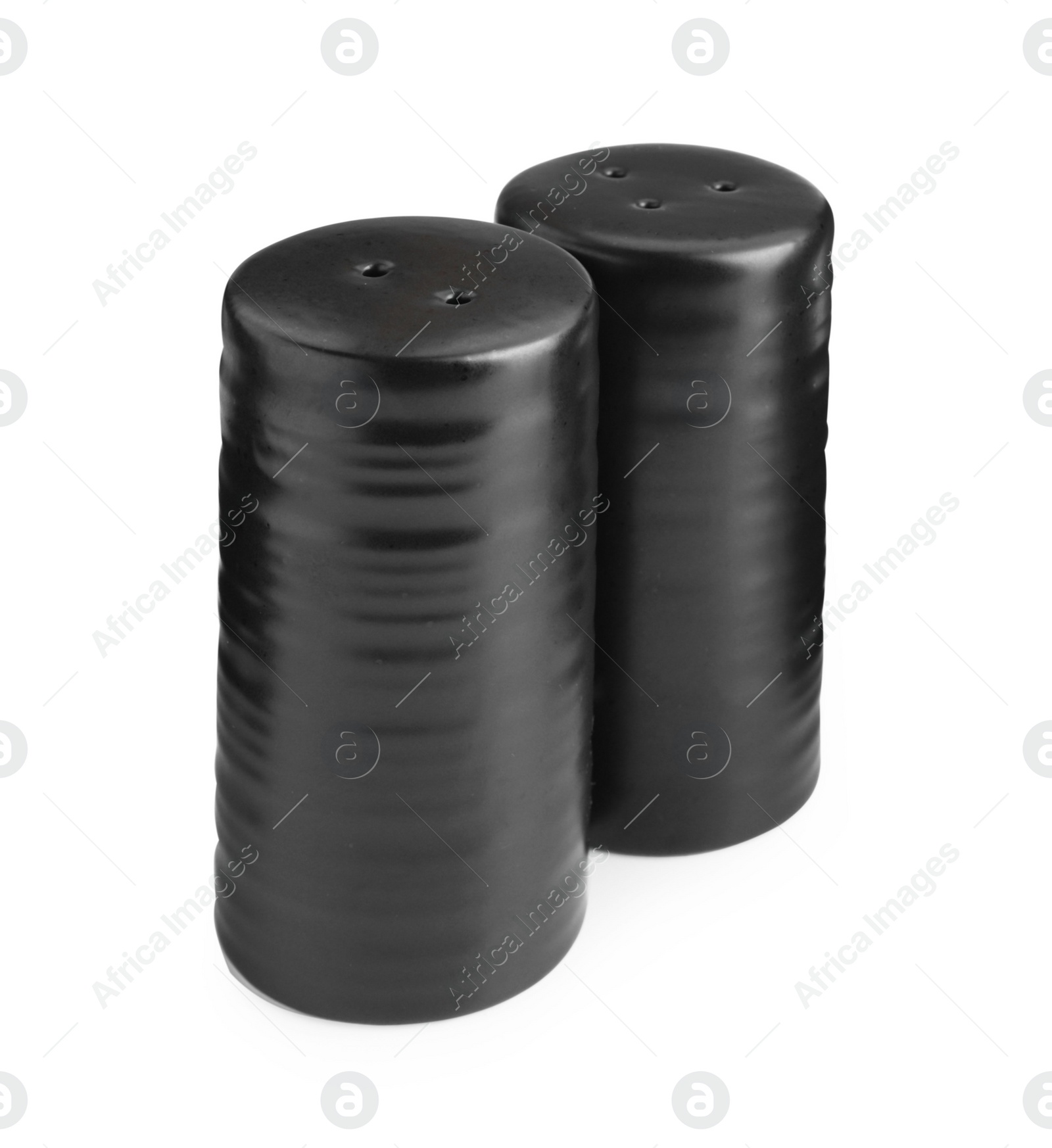 Photo of Black salt and pepper shakers isolated on white