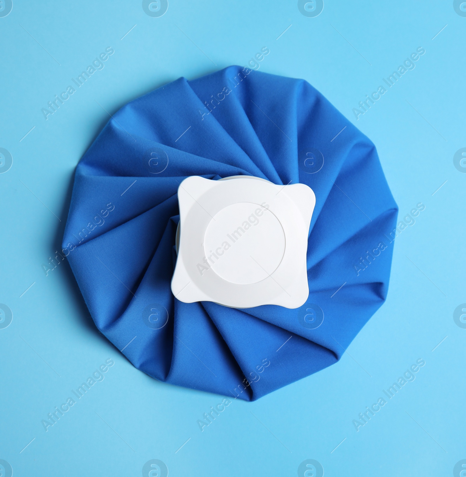 Photo of Ice pack on blue background, top view