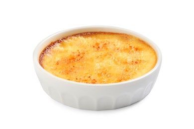 Photo of Delicious creme brulee in ceramic ramekin isolated on white
