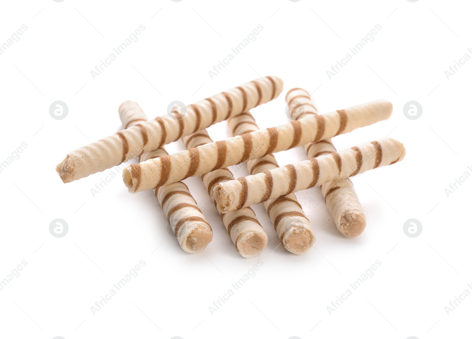 Photo of Tasty wafer roll sticks on white background. Crispy food