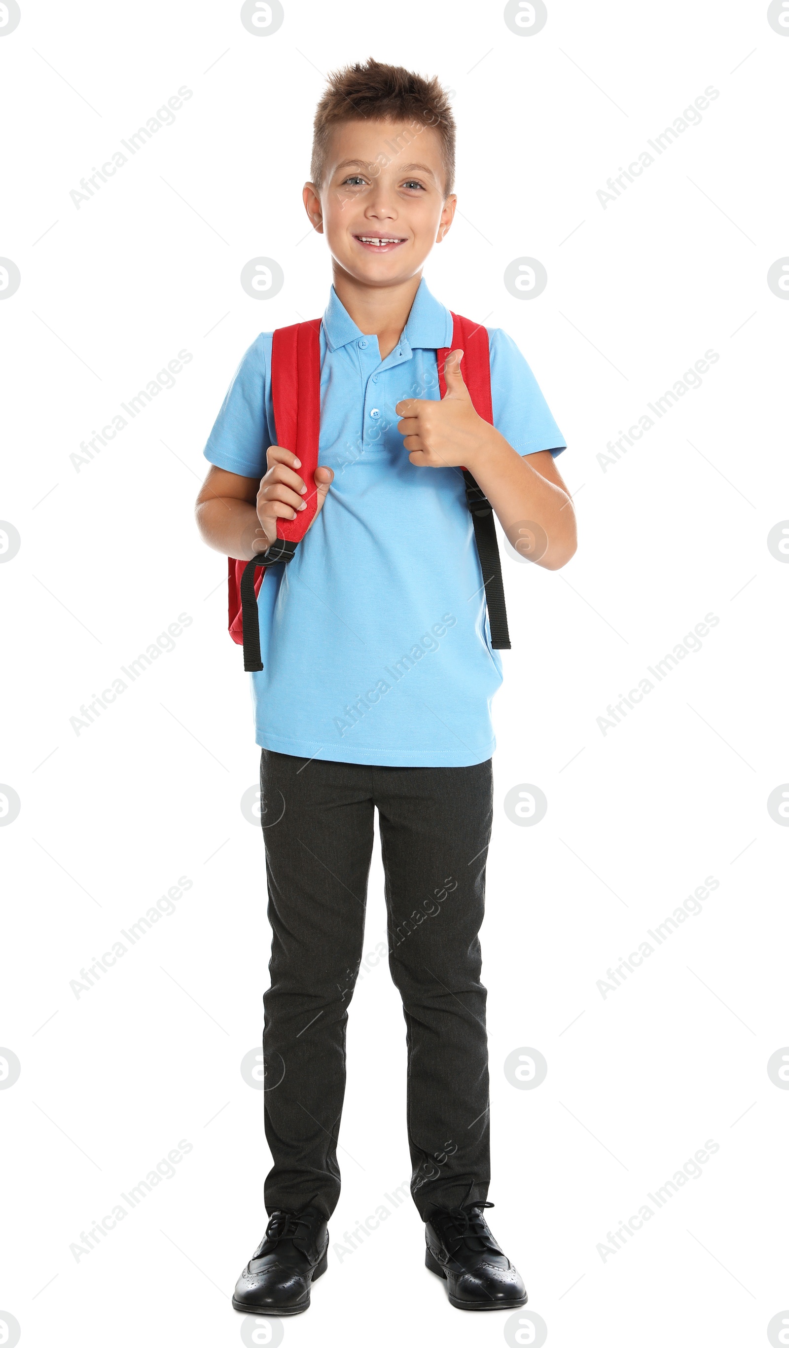 Photo of Happy boy in school uniform on white background