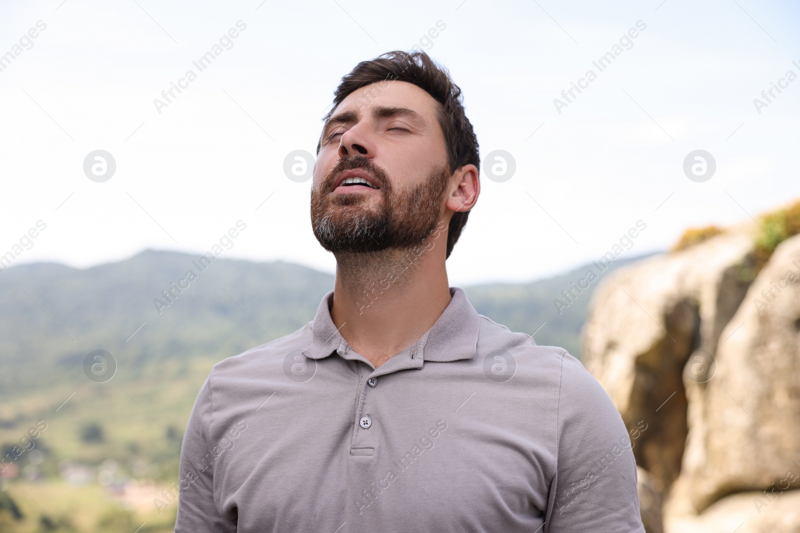 Photo of Feeling freedom. Man enjoying nature in mountains