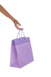 Photo of Woman with paper shopping bag on white background, closeup