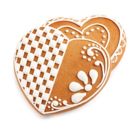 Gingerbread hearts decorated with icing on white background, above view