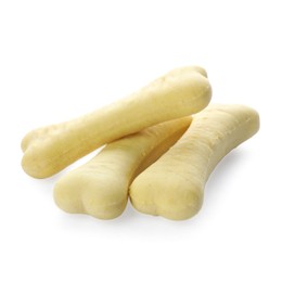 Photo of Bone shaped dog cookies on white background