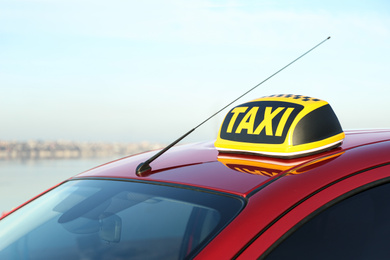 Roof light with word TAXI on car outdoors