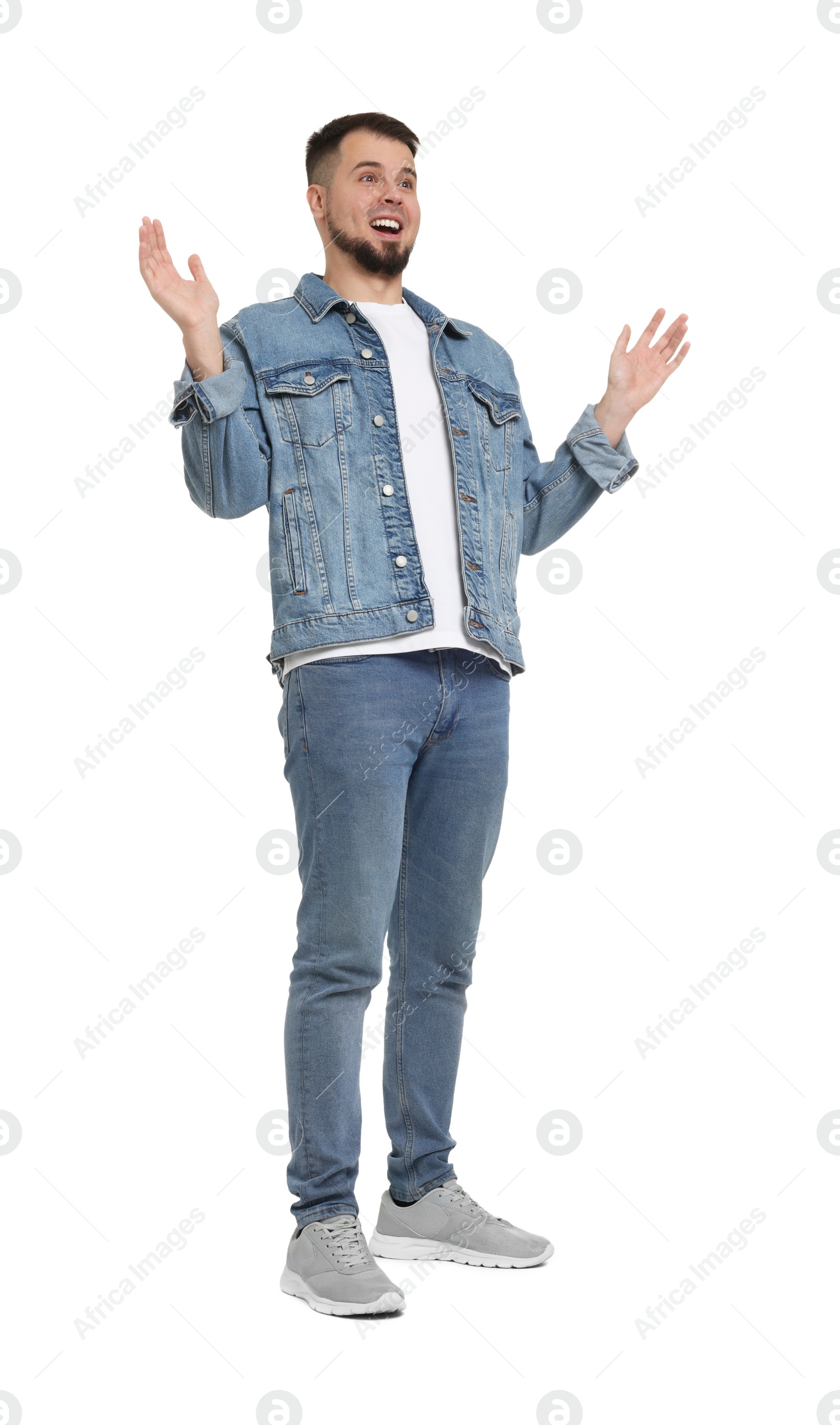 Photo of Shocked man in denim clothes isolated on white