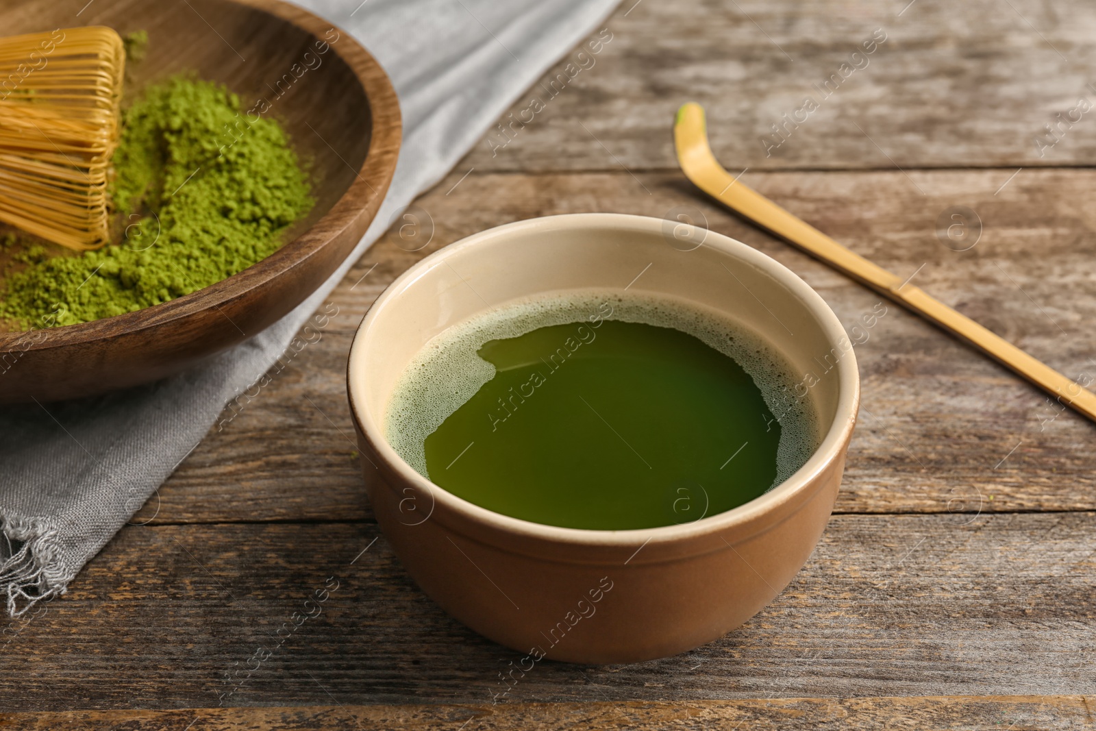 Photo of Chawan with fresh matcha tea on table