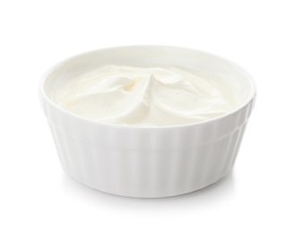 Bowl with sour cream on white background