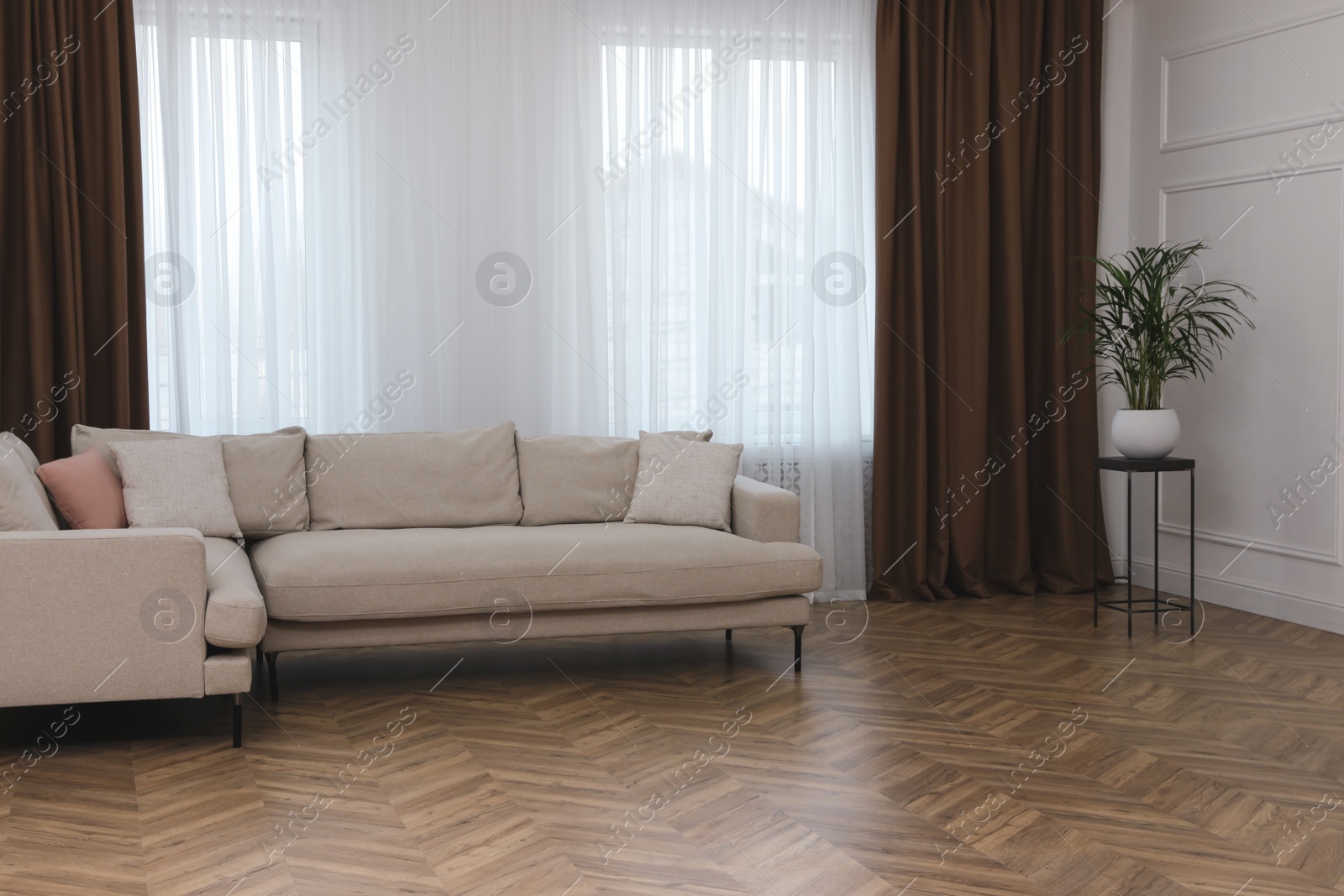 Photo of Modern living room with parquet flooring and stylish furniture