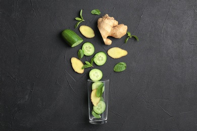 Flat lay composition with ingredients for detox summer drink on grey background