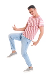 Happy attractive man dancing on white background