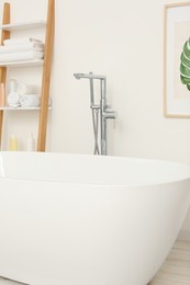 Stylish white tub in bathroom. Interior design