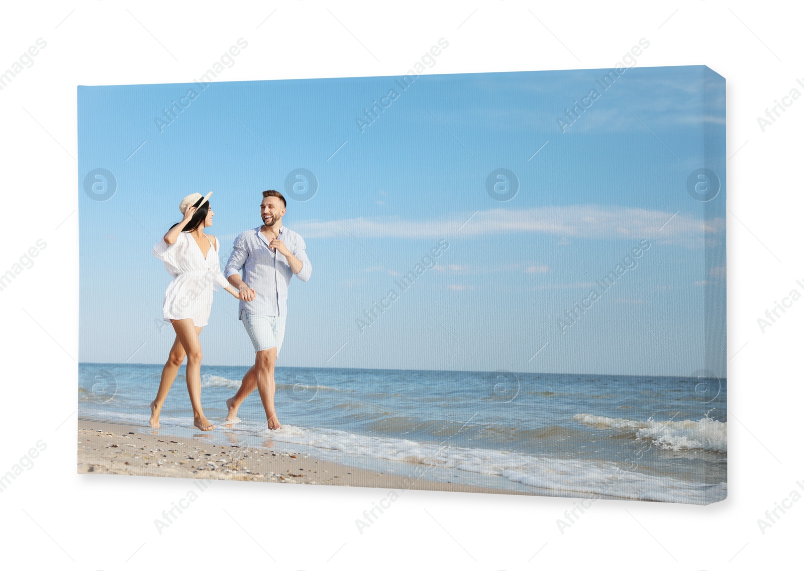 Image of Photo printed on canvas, white background. Happy young couple running together on beach