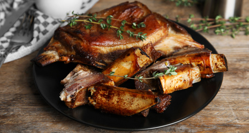 Delicious roasted ribs served on wooden table. Banner design