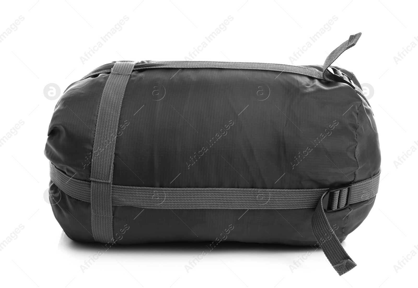 Photo of Sleeping bag in case on white background. Camping equipment