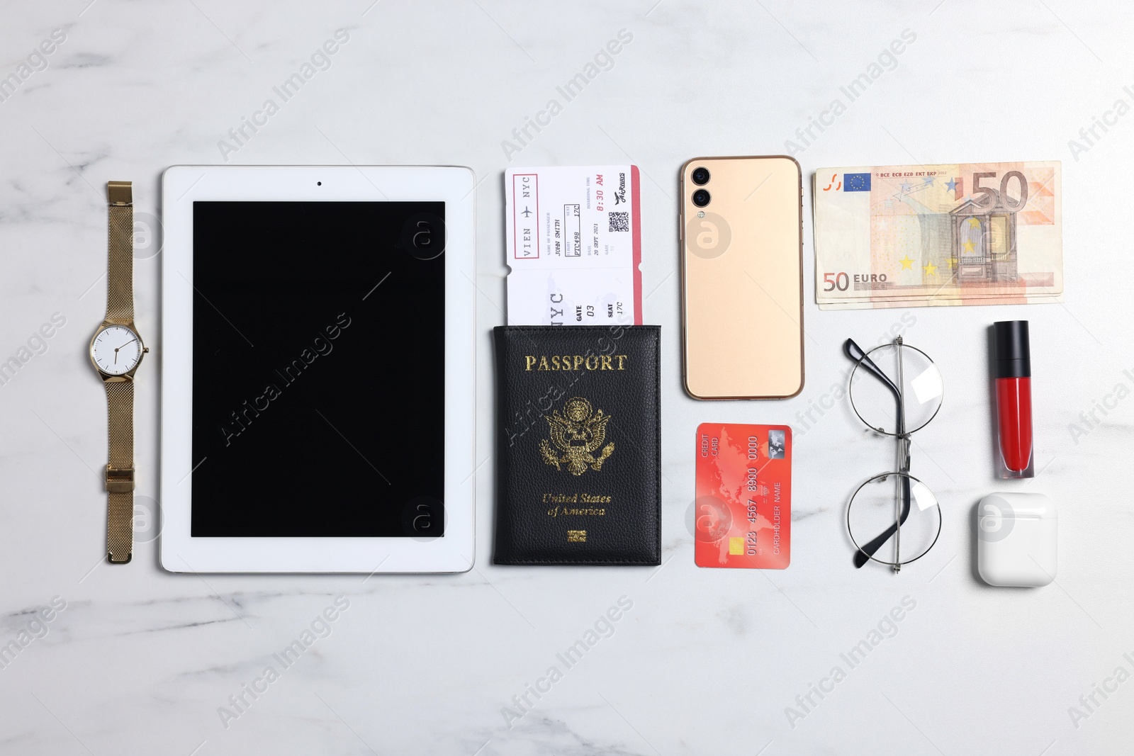 Photo of Flat lay composition with documents, money and accessories on white marble background. Packing for business trip