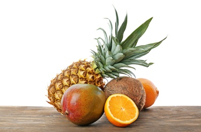 Set of fresh tropical fruits on wooden table