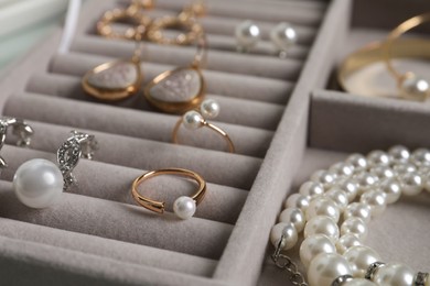 Box with luxurious pearl jewelry, closeup view