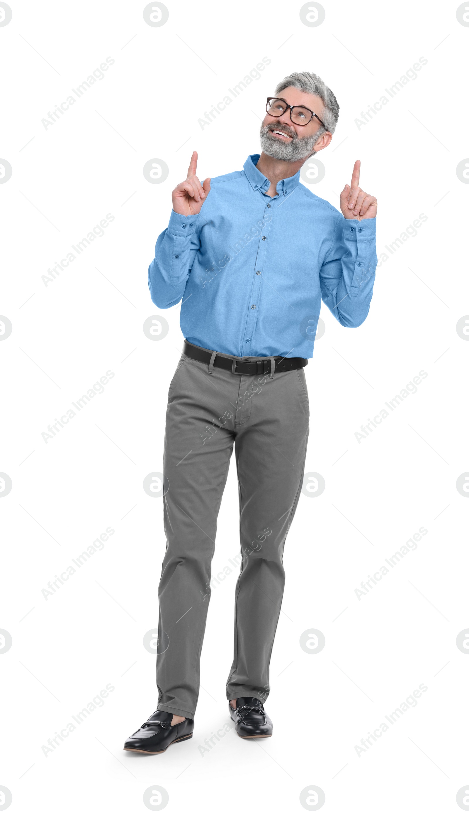 Photo of Mature businessman in stylish clothes posing on white background