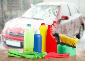 Cleaning supplies on wooden surface at car wash