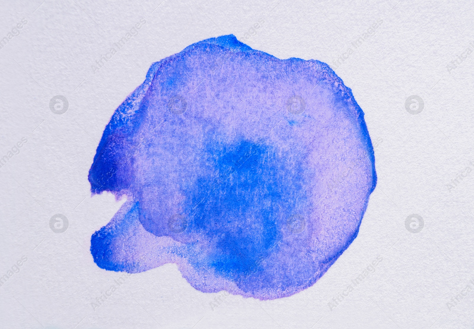 Photo of Blue watercolor blot on white background, top view