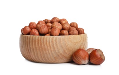 Photo of Bowl with tasty organic hazelnuts on white background