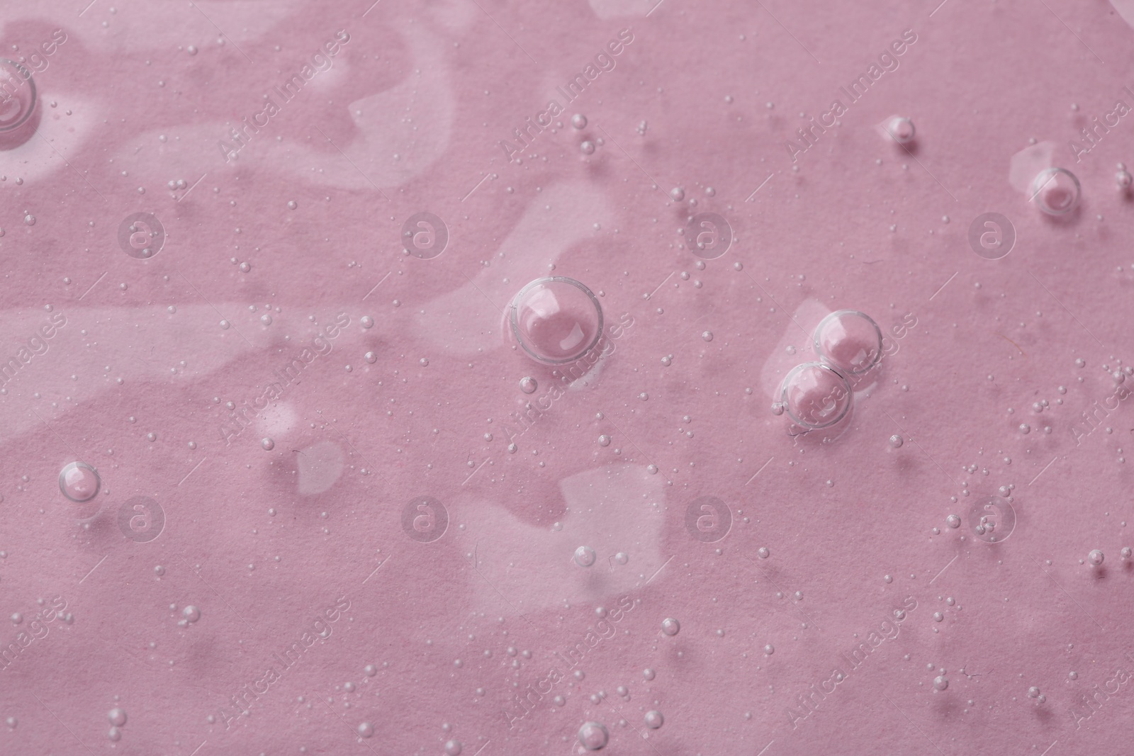 Photo of Cosmetic serum on pink background, top view