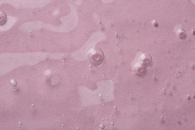 Photo of Cosmetic serum on pink background, top view