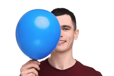 Happy young man with light blue balloon on white background